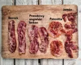 Różne rodzaje bekonu i boczku: boczek, prawdziwy angielski bekon, pancetta i jamón na desce.